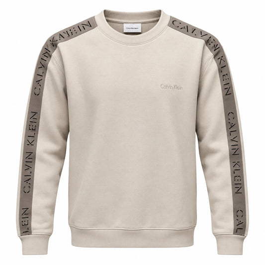 Beige Calvin Klein Jeans crewneck sweatshirt with taupe logo sleeve tapes and tonal chest lettering.