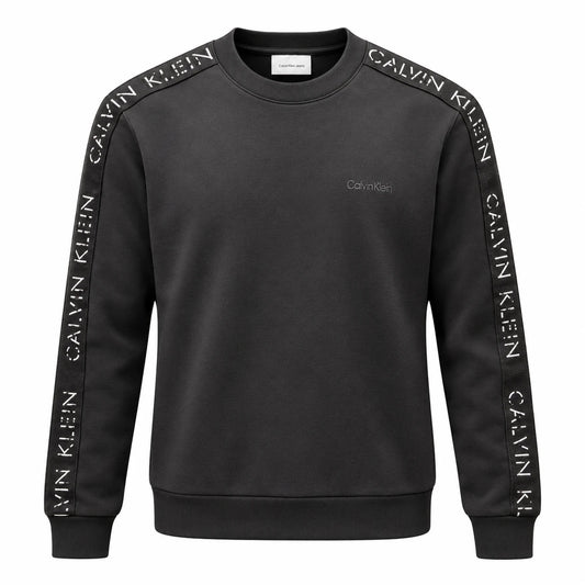 Black Calvin Klein Jeans crewneck sweatshirt with white lettering on dark sleeve tapes and a tonal chest logo.