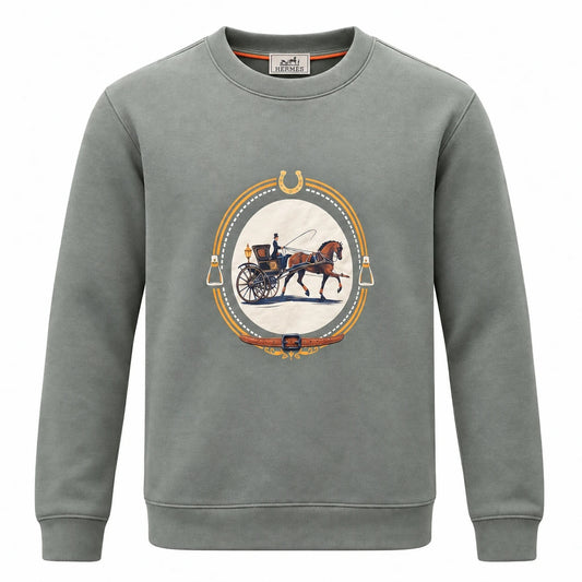 Sage green Hermès sweatshirt with an oval horse-and-carriage graphic and equestrian border.