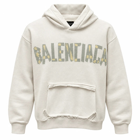 Off-white Balenciaga hoodie with grey and pale yellow chest lettering and a distressed front pocket panel.
