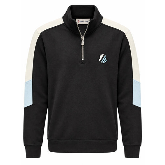 Black Moncler quarter-zip with cream and ice-blue sleeve panels