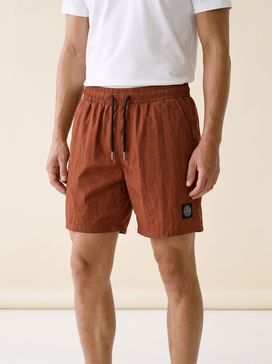 MODEL·STONE ISLAND — Compass Patch Swim Shorts - Rust
