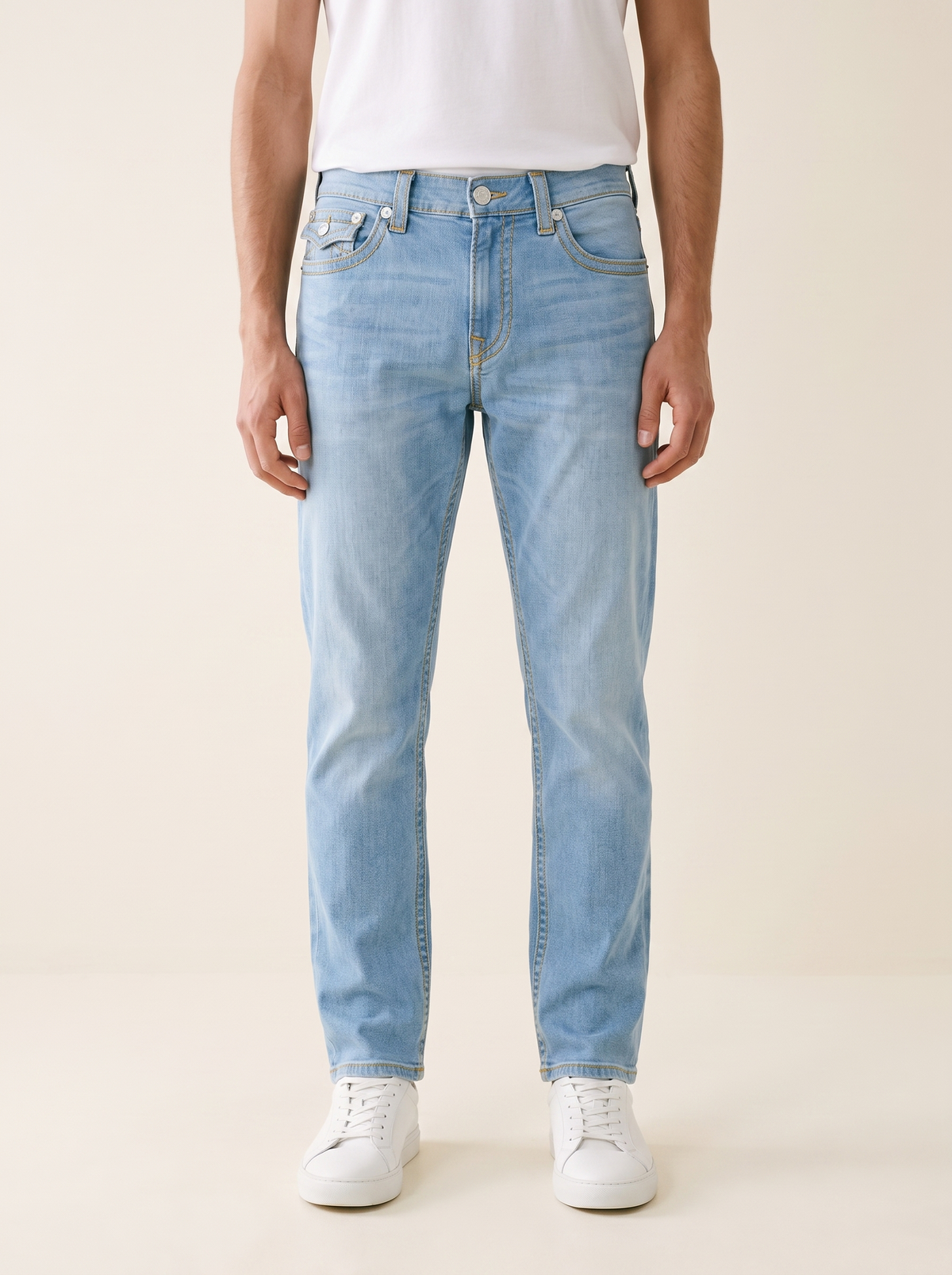 MODEL·TRUE RELIGION — Gold Stitch Light Wash Denim